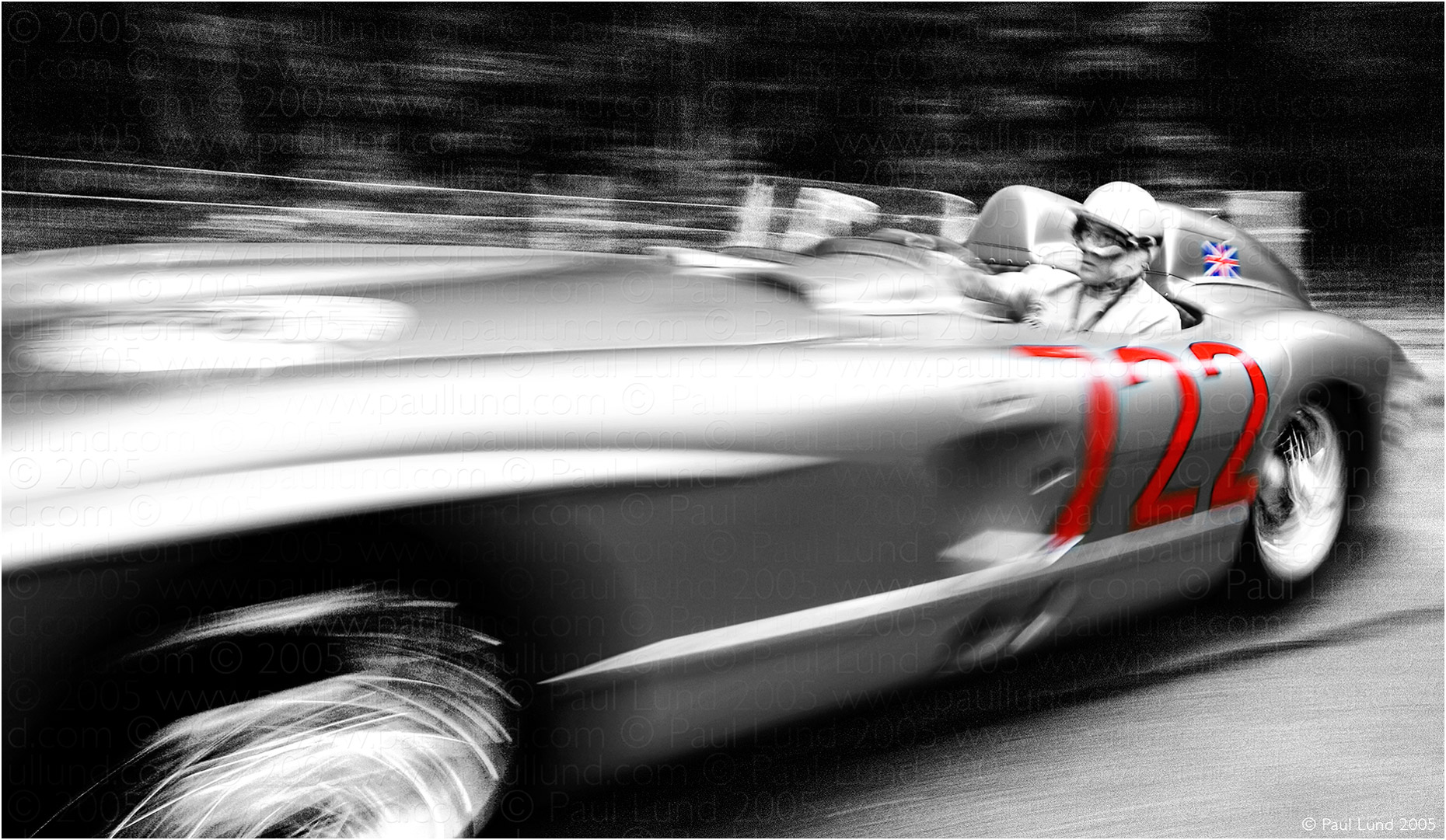 Sir Stirling Moss in his 1955 Mille Miglia winning Silver Arrows Mercedes Benz 300 SLR at The Goodwood Festival of Speed 2005. Photographer: Paul Lund