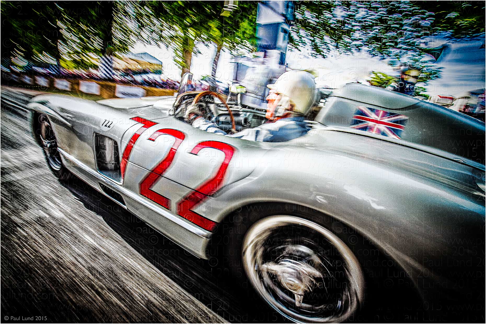 Sir Stirling Moss in his 1955 Mille Miglia winning Silver Arrows Mercedes Benz 300 SLR at The Goodwood Festival of Speed 2015. Photograher: Paul Lund